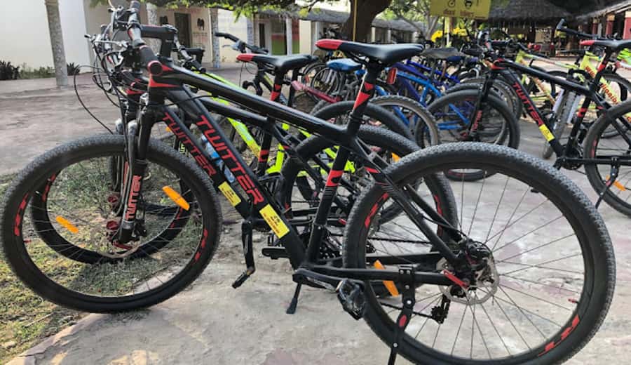 Diani Beach: Village tour on a bike with hotel pick-up - Starting at Diani Bazaar and getting comfortable on the bike